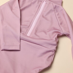 A June Long Sleeve One-Piece with a zipper on it.