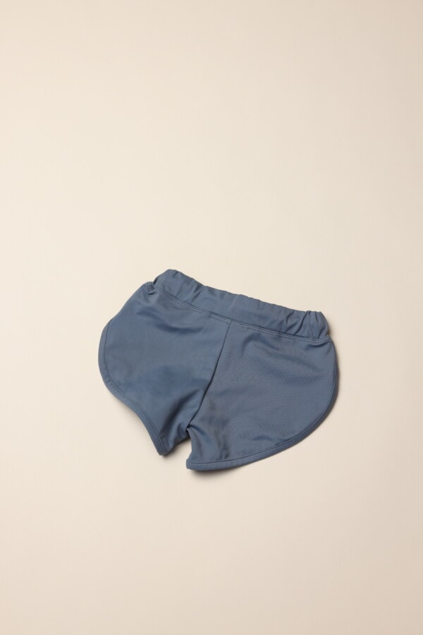 A pair of Mesa Trunks on a white surface.
