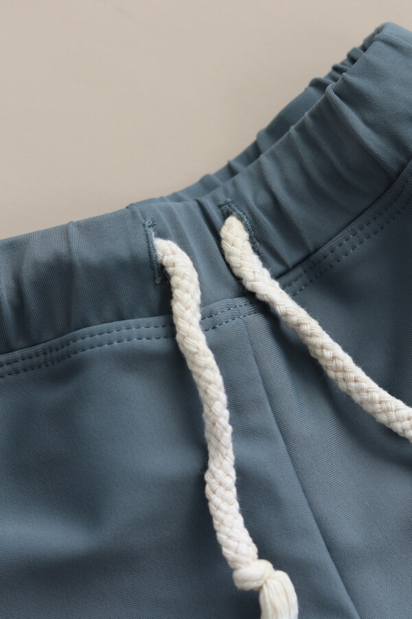 A close up of a pair of Mesa Trunks with a white drawstring.