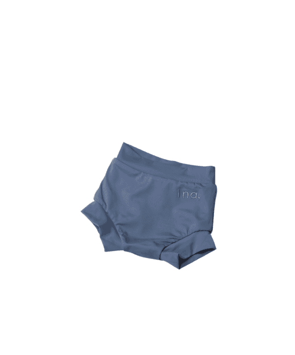 Pair of Lumi Short Swim Nappy - Mineral Colour isolated on a white background.