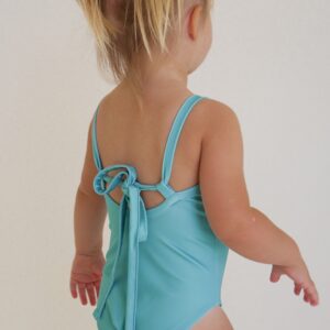 A little girl wearing the Sorbet Summer - Mara One-Piece swimsuit.