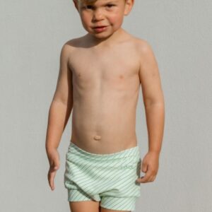 A boy and a girl standing next to each other wearing the Retro Wave By Ina - Lumi Short Swim Nappy.