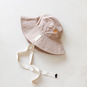 WS - Golden Meadows Collection - Golden Sun Bucket Hat with a white ribbon on it.