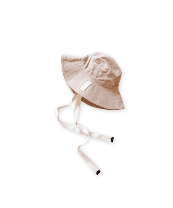 Golden Sun Bucket Hat - Sahara Sand with chin straps on a white background.