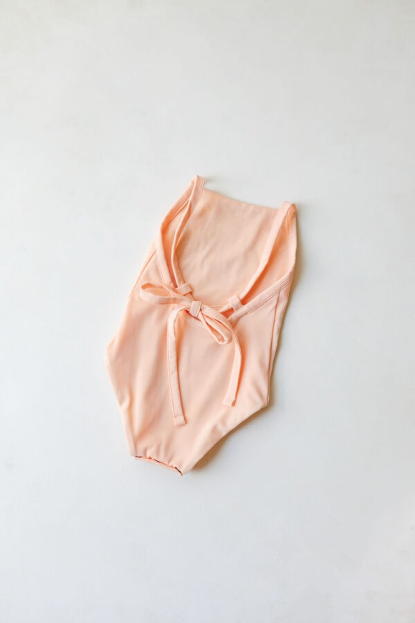 Mara One-Piece - Peach Blossom with ties displayed on a plain background.