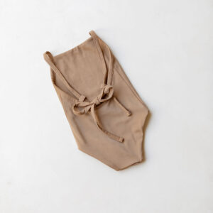 Mara One-Piece - Warm Pecan with straps lying flat on a white surface.
